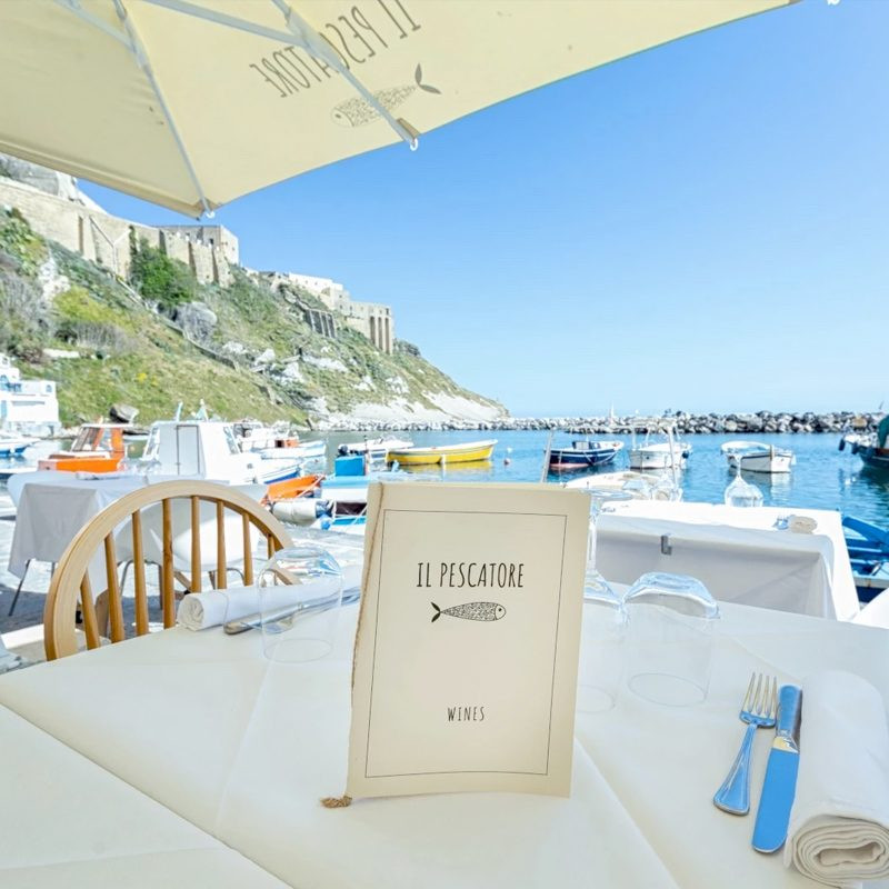 Table set at a seafront restaurant on the Amalfi Coast
